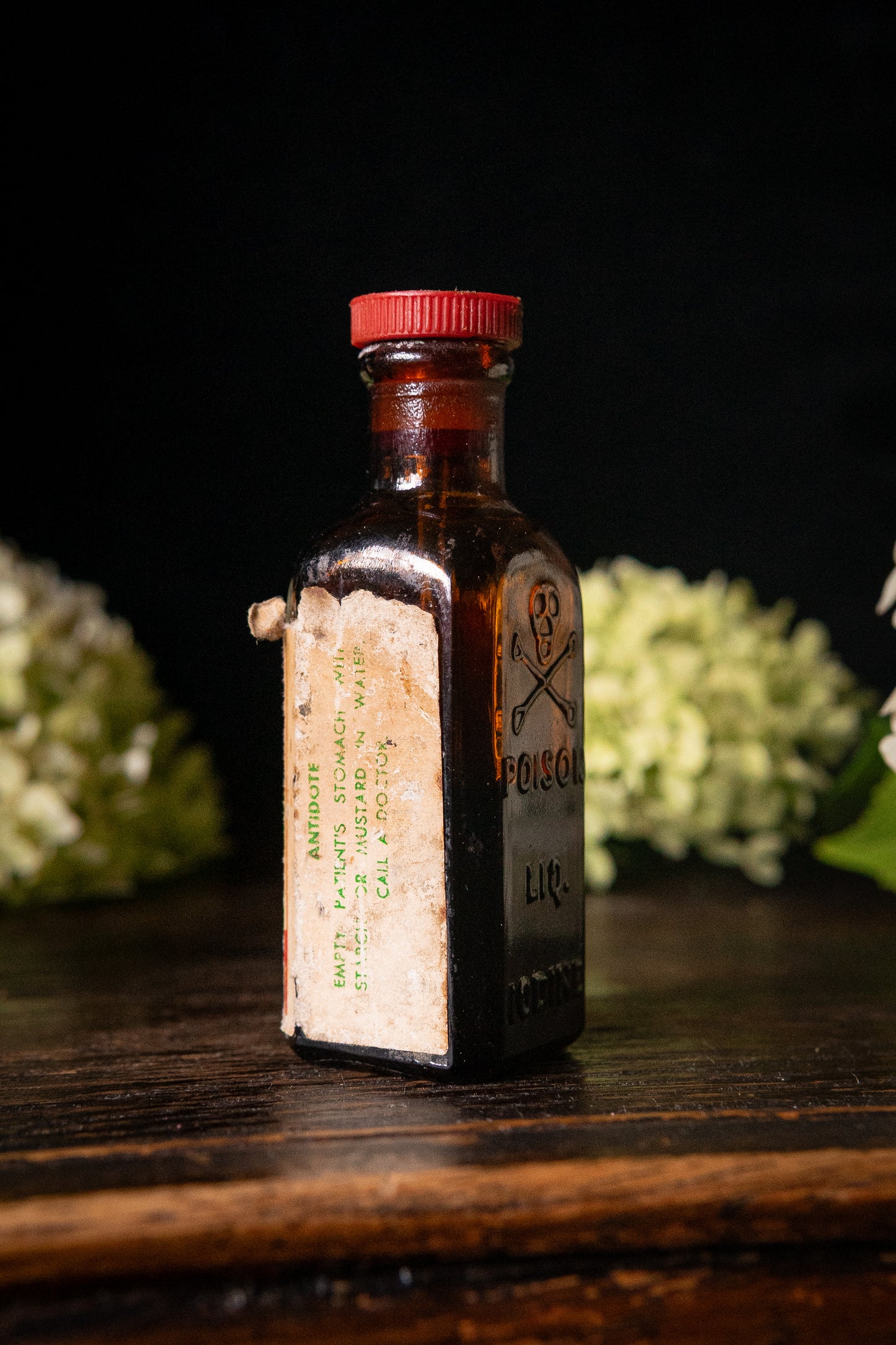 Vintage poison iodine bottle with skull and crossbones