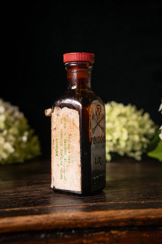 Vintage poison iodine bottle with skull and crossbones