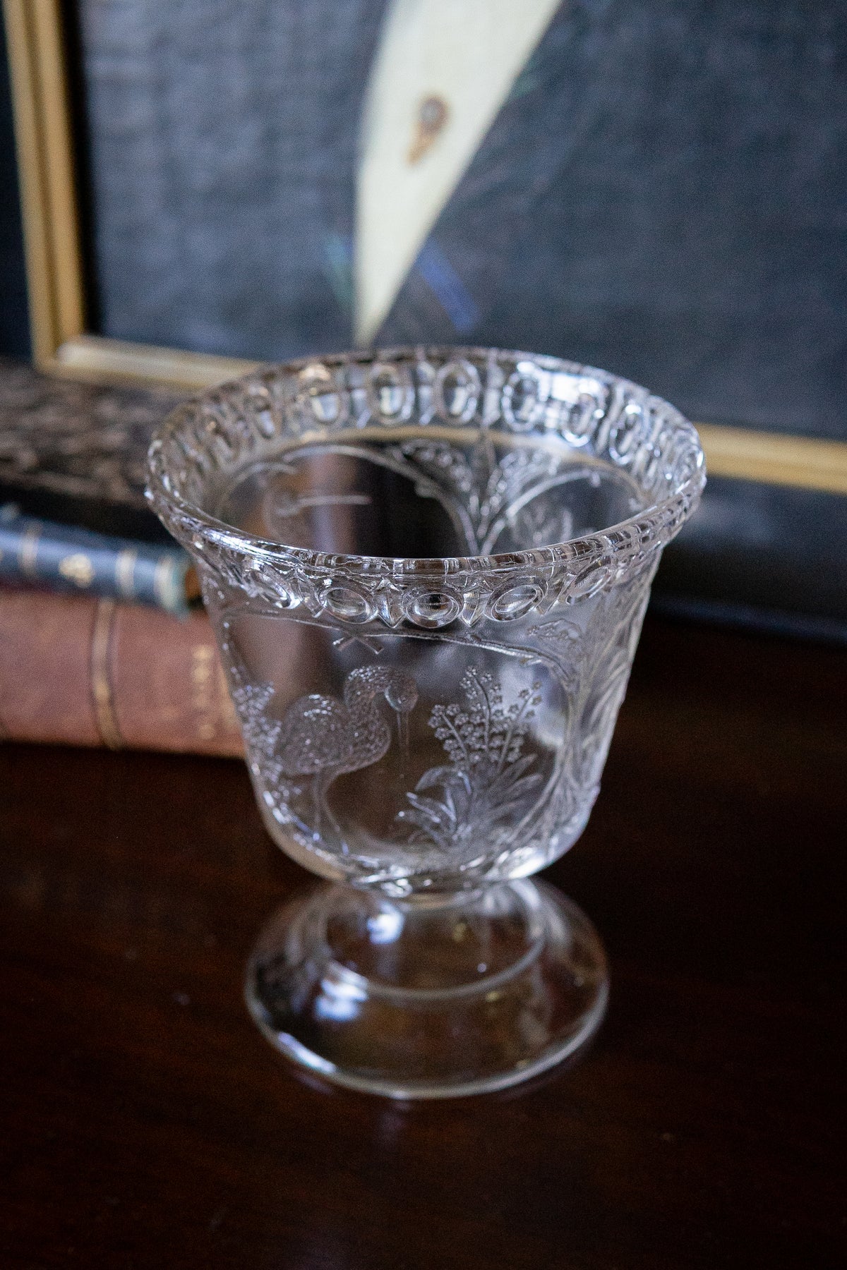 Antique glass pedestal vase with cranes