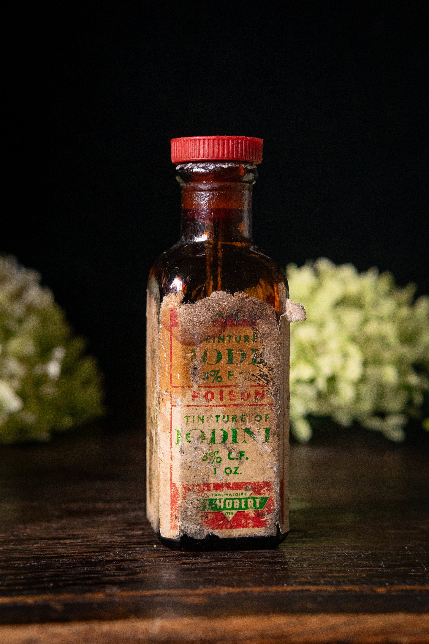 Vintage poison iodine bottle with skull and crossbones