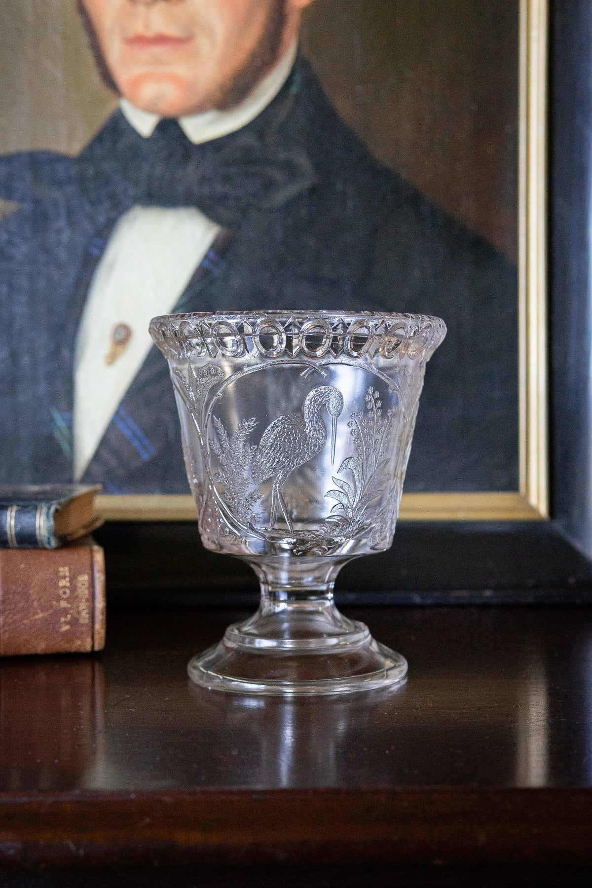 Antique glass pedestal vase with cranes