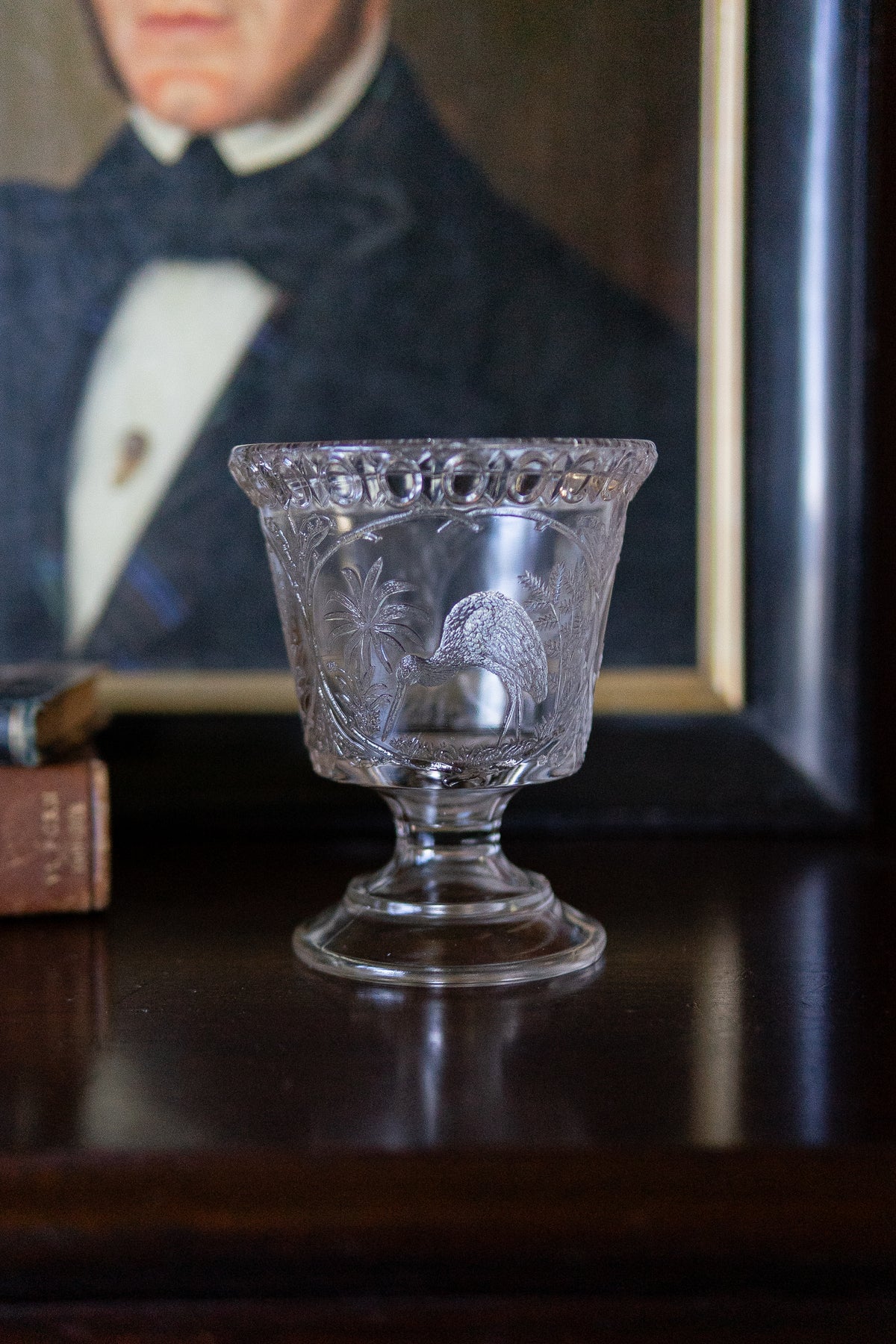 Antique glass pedestal vase with cranes