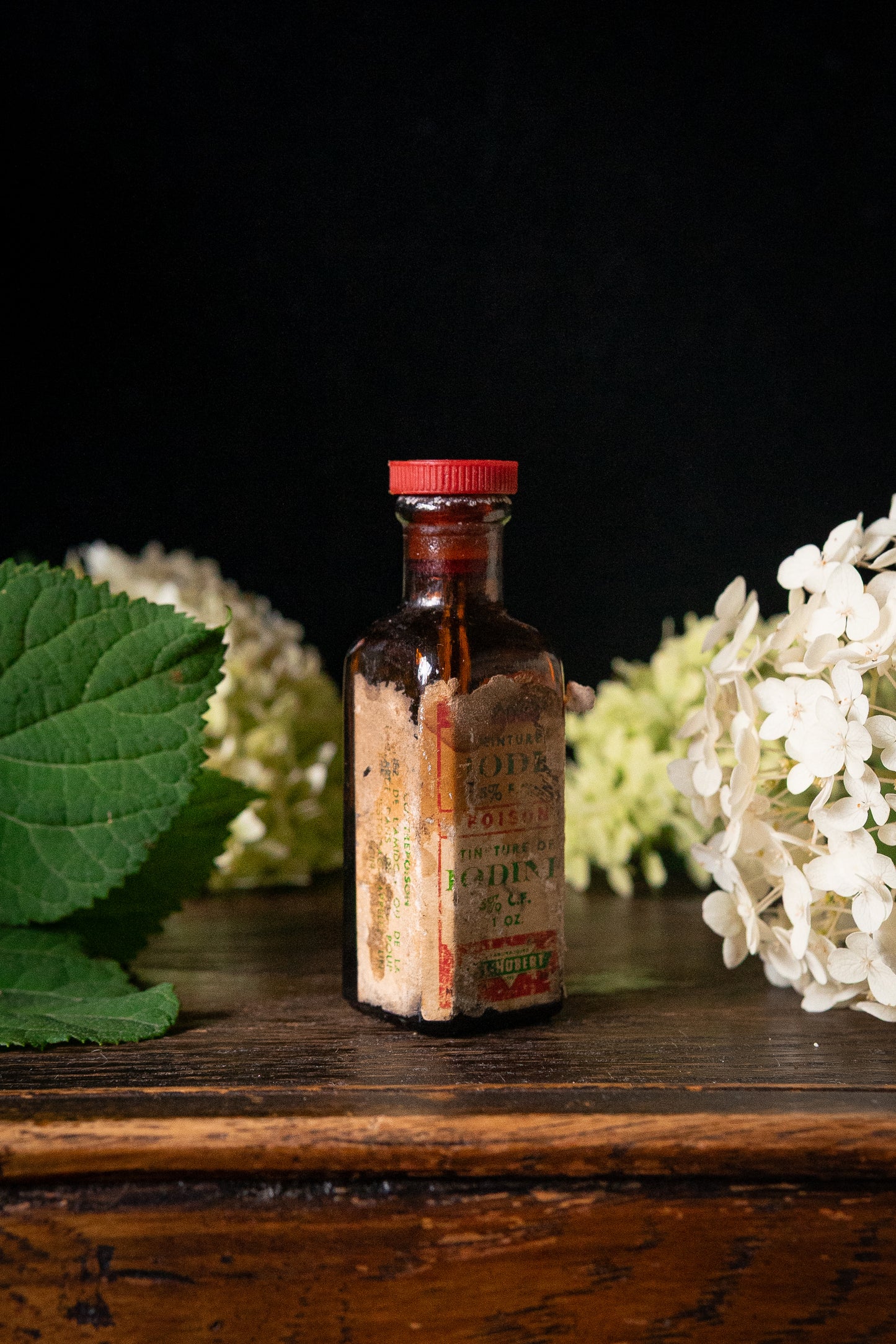 Vintage poison iodine bottle with skull and crossbones