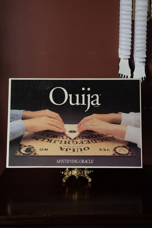Vintage Ouija board with original planchette
