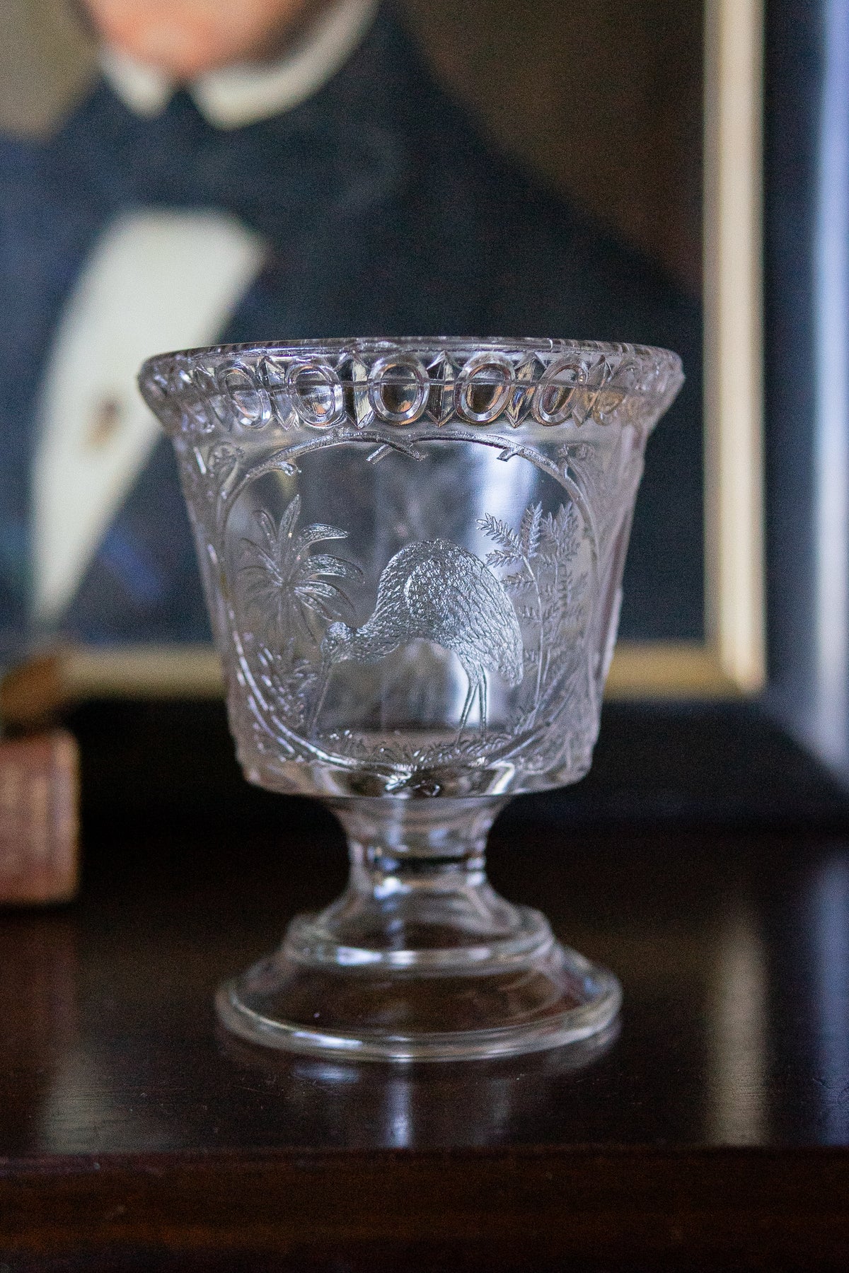 Antique glass pedestal vase with cranes