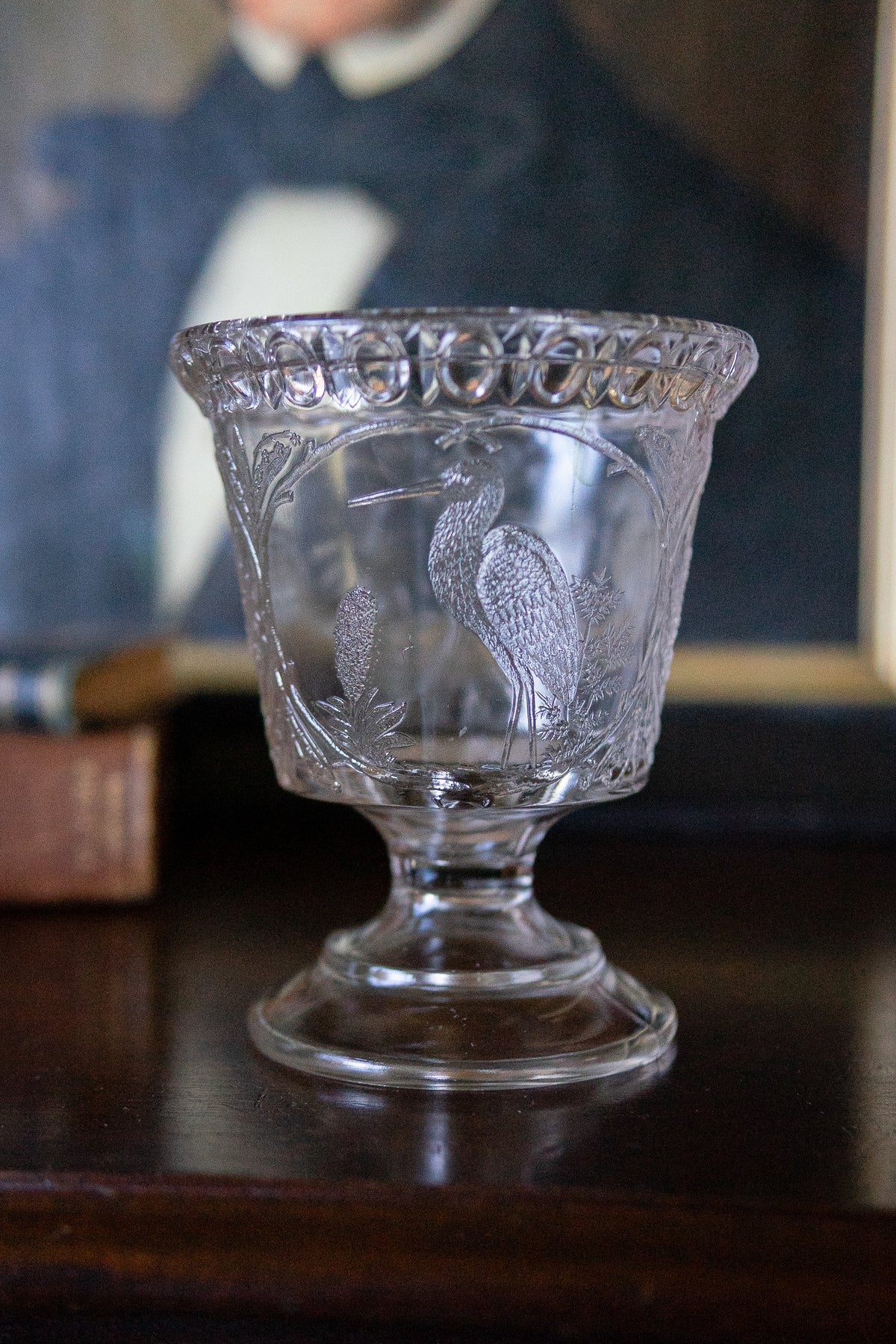 Antique glass pedestal vase with cranes