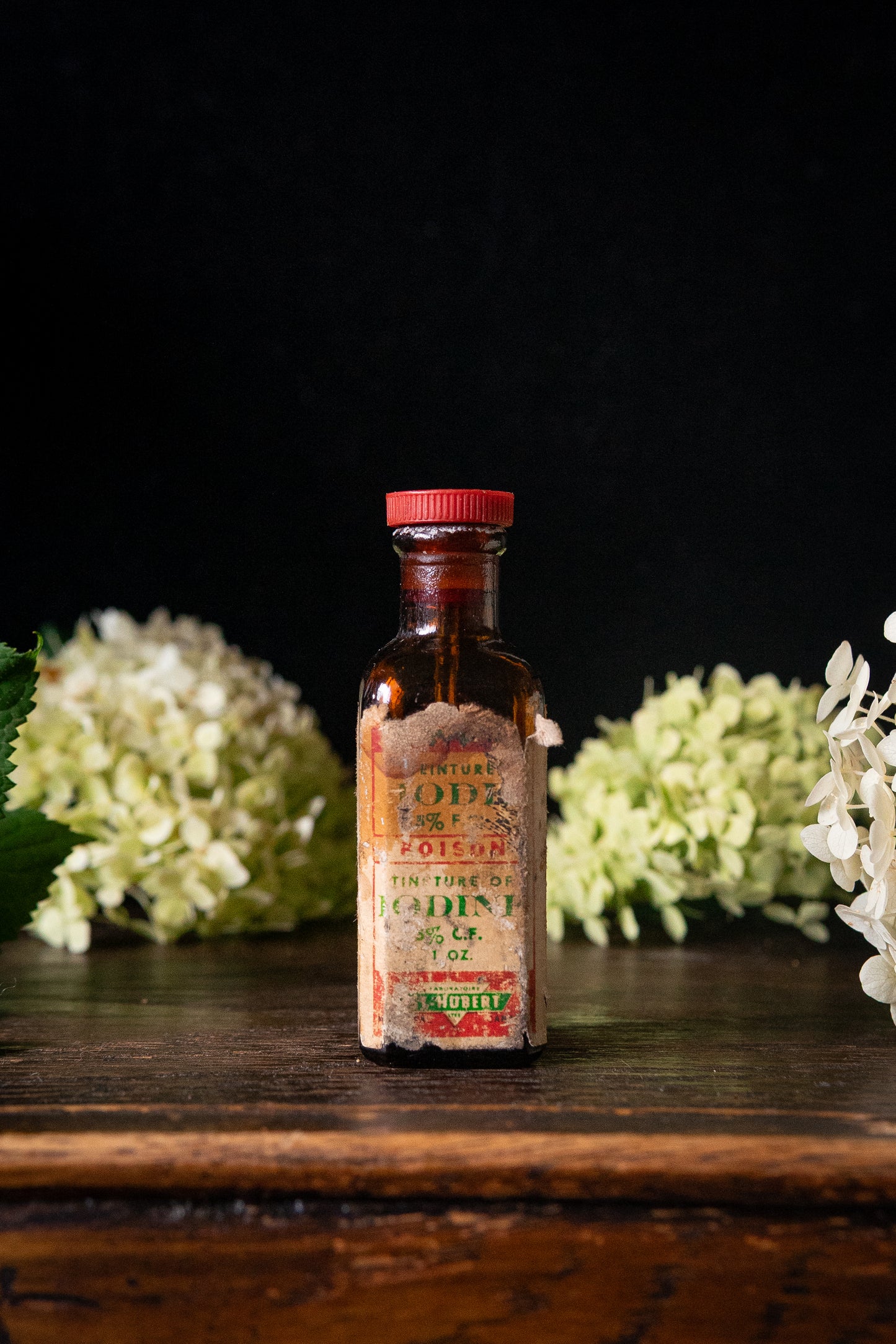 Vintage poison iodine bottle with skull and crossbones
